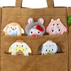 Carry the charm of the forest close with this adorable Sanrio Woodland Creature Handbag, crafted from soft brown corduroy fabric. This delightful accessory brings together cozy textures and whimsical design, perfect for adding a touch of nature-inspired style to your everyday look. Featuring CInnamoroll, Hello Kitty, My Melody, Pompompurin, and Pochacco in a playful woodland creature motif, the handbag showcases beloved Sanrio characters, each with its own unique personality.