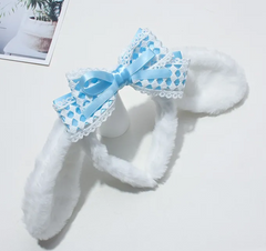 The Cinnamoroll Lace Bow Plush Ears Headband lets you wear your beloved Sanrio character's ears in a soft, plush, huggable way. These spot-on, recognizable ears, fuzzy and white with a specific kind of droop-factor, express kawaii style and Sanrio love simultaneously. Excellent for stylish selfies!