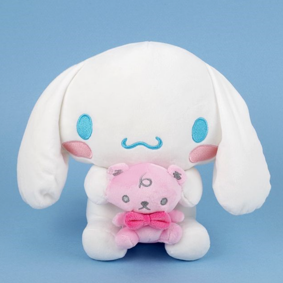 Add a dose of happiness to your life with the adorable Cinnamoroll and Mascot Plushie, featuring your favorite character holding their beloved mascot.  This charming plushie is the perfect gift or decoration to make your space extra kawaii and bring a smile to your face every day!