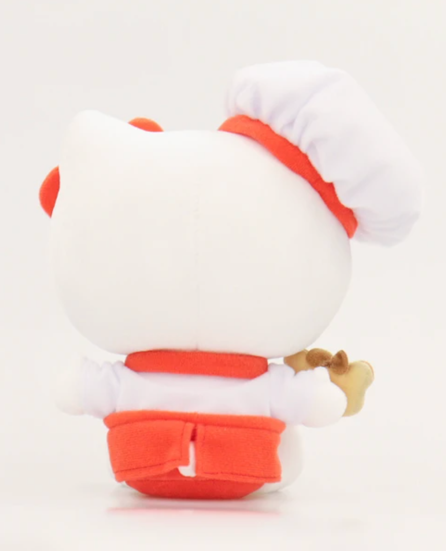 Is there anything Hello Kitty cannot do?! With her iconic bow and apron, Hello Kitty takes on a new role as she whips up delightful treats in the kitchen. The Cookie Baker Hello Kitty Plushie embodies the essence of Hello Kitty's timeless appeal, blending her classic charm with a delightful culinary twist.