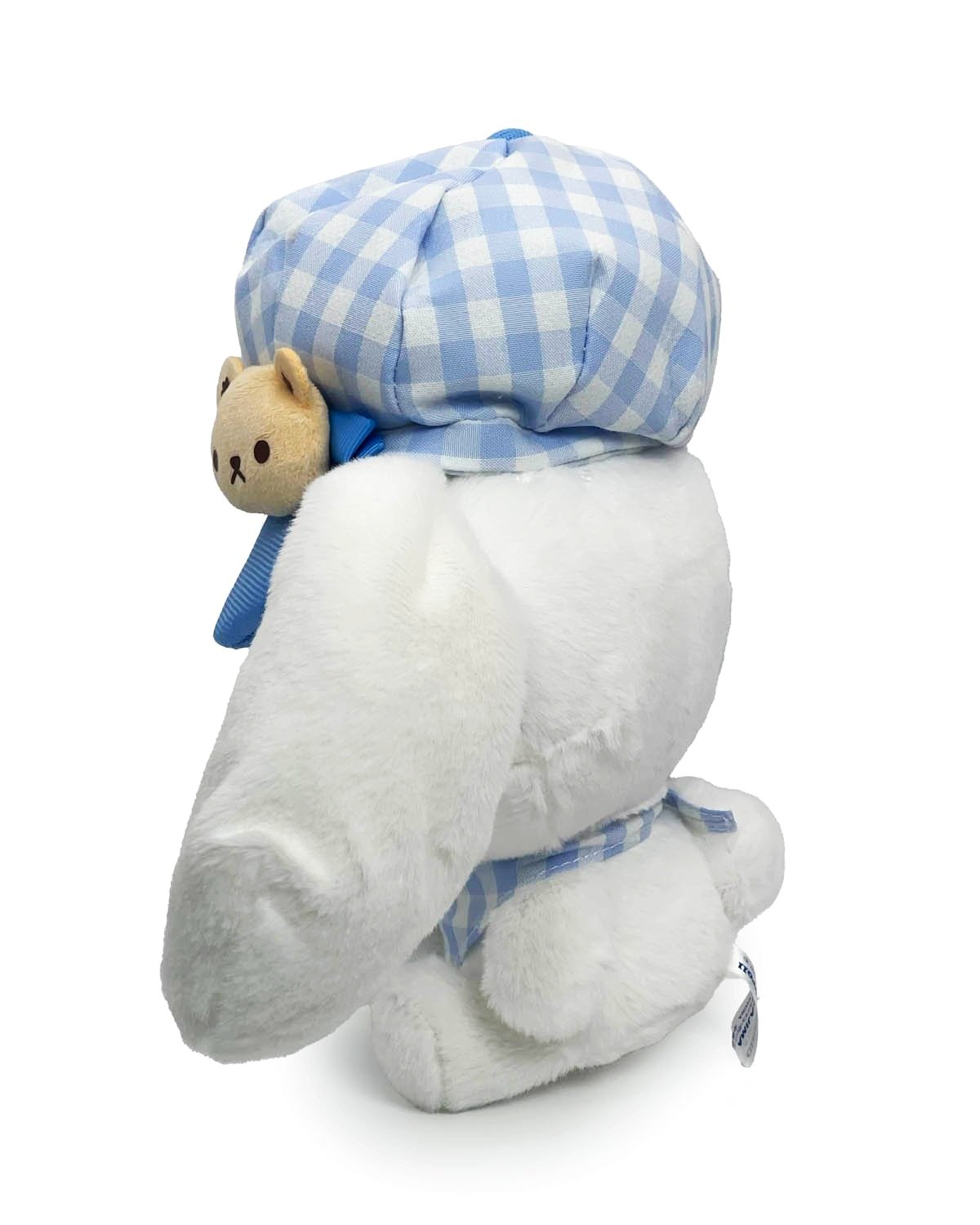 The classic blue gingham print lends a touch of timeless elegance to his attire, while the stylish newsboy hat and neck handkerchief adds a playful and fashionable flair. The Newsboy Cinnamoroll Plushie in Blue Gingham embodies the innocence and sweetness of Cinnamoroll, the beloved Sanrio character adored by fans around the world.