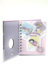 This Memo Pad features all your favourite characters - My Melody, Kuromi, Poccacho, Little Twin Stars, Cinnamoroll, Hangyodon and Tuxedo Sam. They're all dressed for bedtime and ready to help you jot down&nbsp;notes, lists, reminders, doodles, or your precious memories on any given day. The hard-bound cover is die-cut to represent a camera lens, adding a tactile element that rewards everytime you reach for your lil book of treasures.