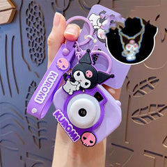 Meet your newest and sweetest party trick! Our Sanrio themed Image Projecting Camera Keychains always bring out the ooohs, ahhhs, and that's sOooOo cute's! This delightful keychain is designed to look like a mini camera and projects an adorable images of a happy kawaii photographer bear, making it a perfect accessory for adding a touch of play to your day. Ideal for kawaii lovers, children, and anyone who enjoys unique and playful accessories.