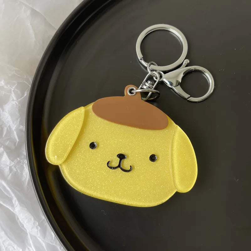 The Sliding Glitter Pompompurin Portable Mirror Keychain is a super cute and functional accessory-- who doesn't need more of that in their life?!


A glitter design in the acrylic gives the sweetest shimmer effect which adds a playful touch and visual appeal. Double-sided high quality acrylic protects the rounded mirror inside. Perfect for quick touch-ups or checking your lovely smile on the go. Having it on a keychain means you can easily carry it around without worrying about it taking up too much space.