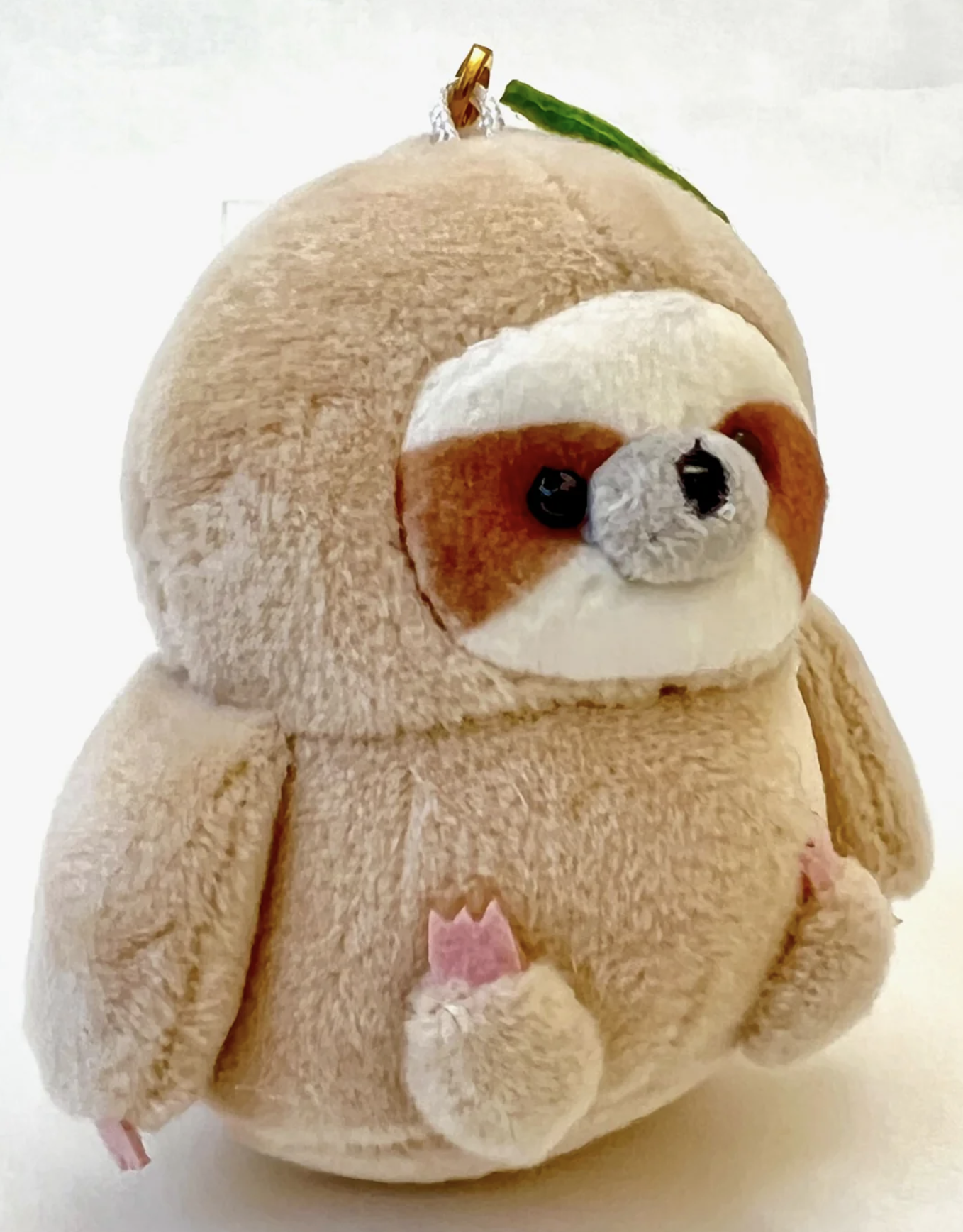 Meet our adorable Sloth Charm Plush Keychain, your new companion for slow and steady days. This irresistibly cute keychain features a charming sloth design, perfect for adding a touch of whimsy to your keys or backpack.