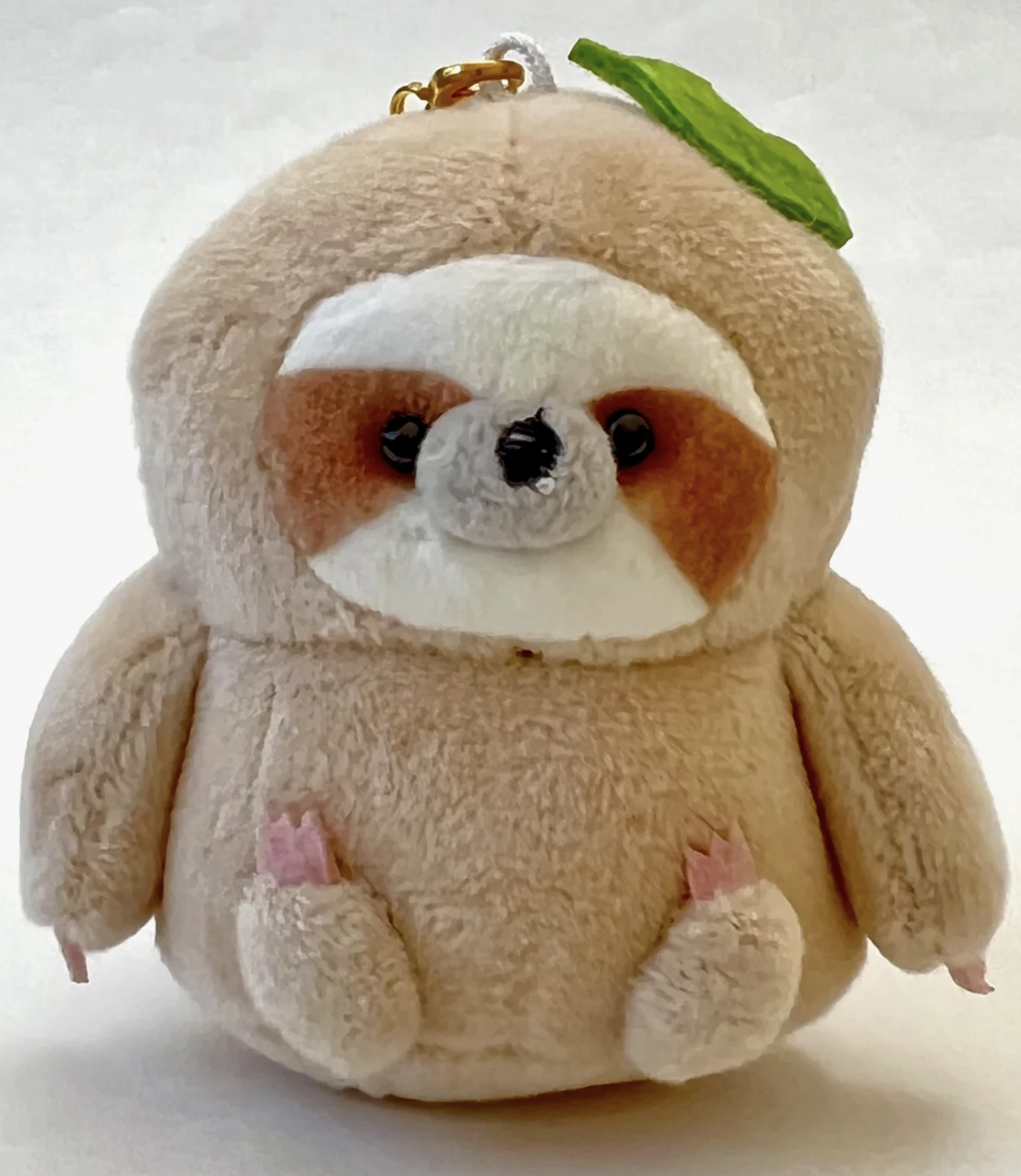 Meet our adorable Sloth Charm Plush Keychain, your new companion for slow and steady days. This irresistibly cute keychain features a charming sloth design, perfect for adding a touch of whimsy to your keys or backpack.