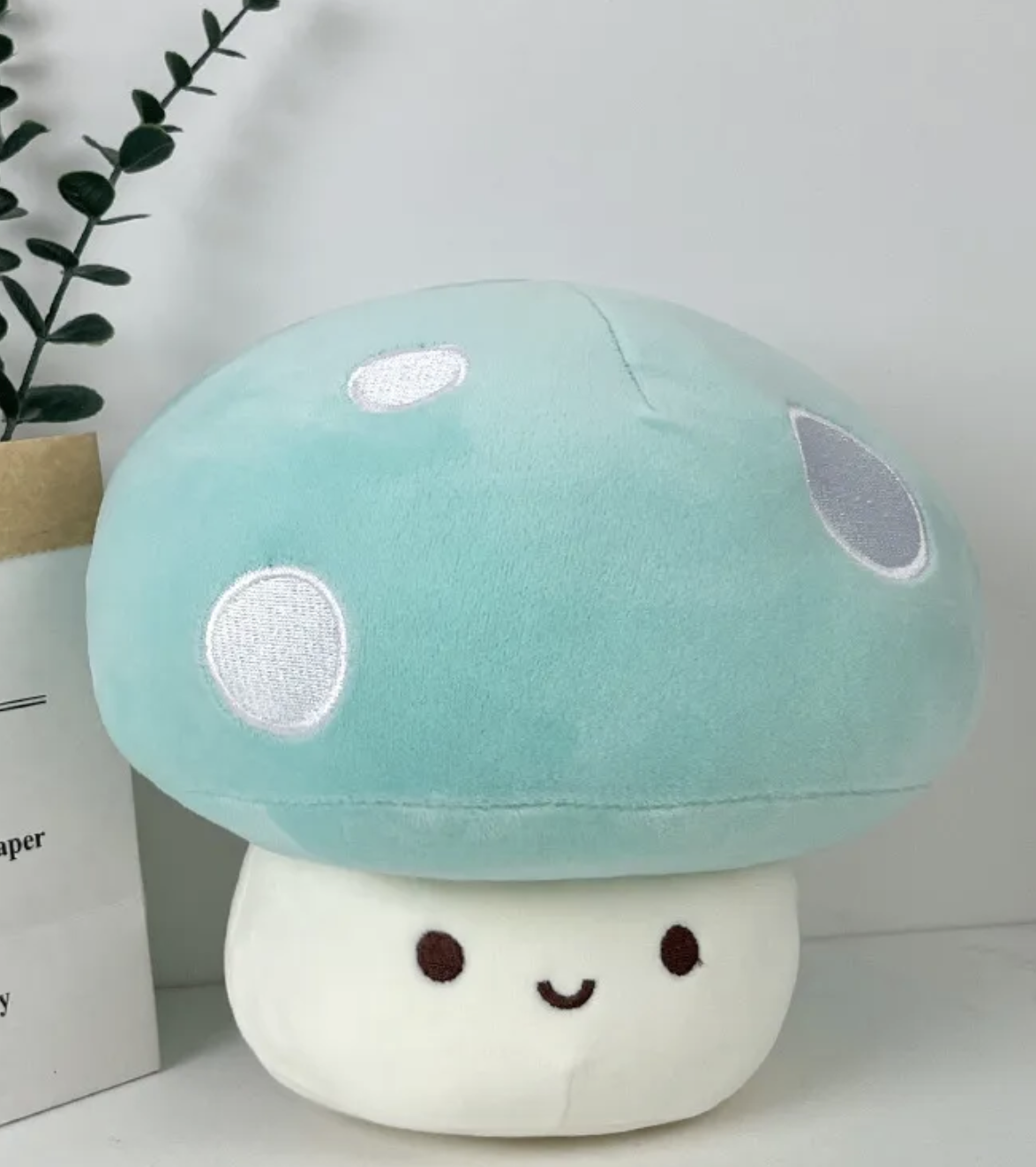 The whimsical Smiling Mushroom Plushie Gang! A vibrant array of adorable fungi companions that will add a pop of color and cheer to any space! Each plush in this collection is lovingly crafted with soft, huggable materials and comes in a variety of bright and playful colors.