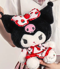 Our delightful Strawberry Fields Kuromi Plushie features Kuromi in an adorable strawberry print dress&nbsp;—a delightful blend of mischief and charm! Dressed in a vibrant strawberry print dress adorned with playful bow ruffles, she’s the perfect embodiment of summer whimsy. With her cheeky grin and eye-catching design, this plushie stands out as a unique collectible or a sweet companion.