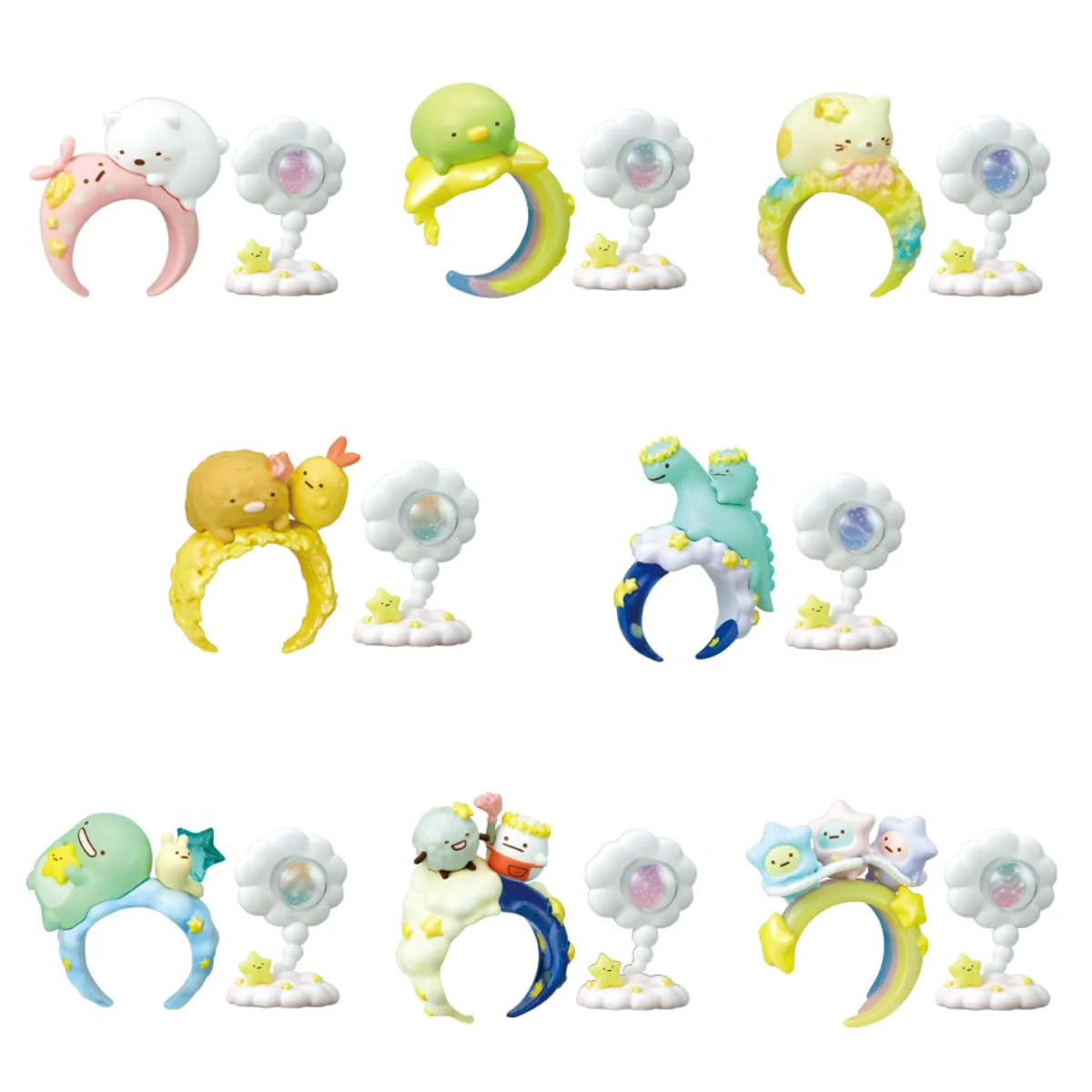 Embark on a celestial adventure with the Sumikko Gurashi Starry Sky Ring &amp; Holder Blind Box! Each box contains a surprise ring and matching holder, featuring your favorite Sumikko Gurashi characters—like Shirokuma and Tokage—in dreamy clouds and starry sky themes. The rings are beautifully detailed, with enchanting designs that capture the magic of the night sky, while the holders provide a charming way to display and store your ring.