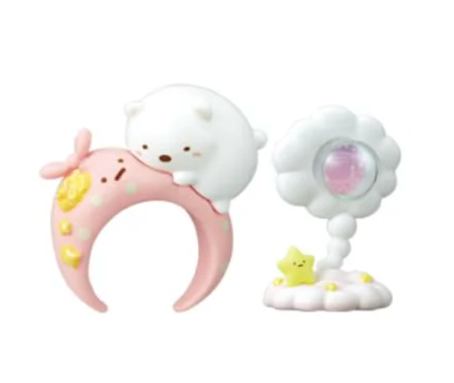 Embark on a celestial adventure with the Sumikko Gurashi Starry Sky Ring &amp; Holder Blind Box! Each box contains a surprise ring and matching holder, featuring your favorite Sumikko Gurashi characters—like Shirokuma and Tokage—in dreamy clouds and starry sky themes. The rings are beautifully detailed, with enchanting designs that capture the magic of the night sky, while the holders provide a charming way to display and store your ring.