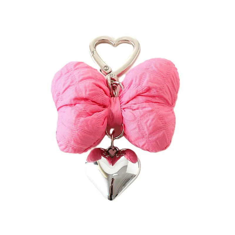 Add a touch of sweetness to your accessories with the Sweetheart Big Kawaii Cloth Bow Keychains! These oversized, fabric bows come in a variety of charming pastel colors and feature a soft, plush texture that’s both cute and eye-catching. Perfect for attaching to your keys, bags, or backpacks, these keychains add a playful, girly flair to any outfit.