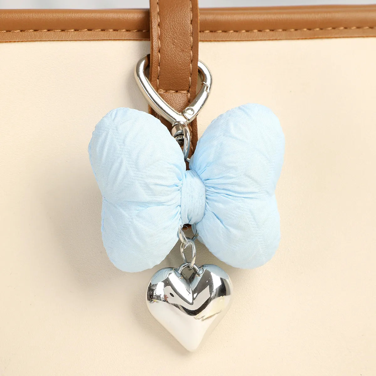 Add a touch of sweetness to your accessories with the Sweetheart Big Kawaii Cloth Bow Keychains! These oversized, fabric bows come in a variety of charming pastel colors and feature a soft, plush texture that’s both cute and eye-catching. Perfect for attaching to your keys, bags, or backpacks, these keychains add a playful, girly flair to any outfit.