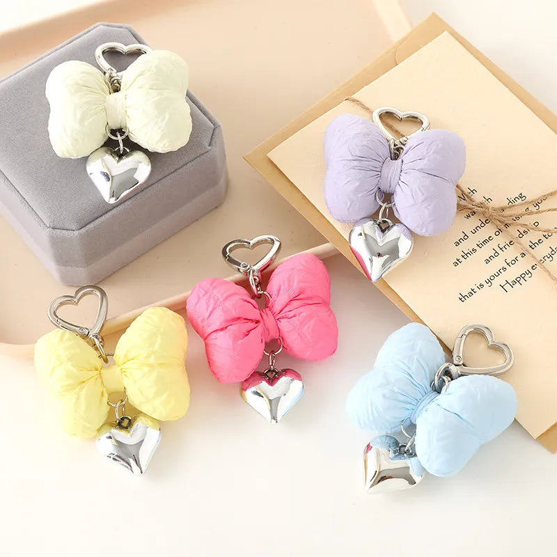 Add a touch of sweetness to your accessories with the Sweetheart Big Kawaii Cloth Bow Keychains! These oversized, fabric bows come in a variety of charming pastel colors and feature a soft, plush texture that’s both cute and eye-catching. Perfect for attaching to your keys, bags, or backpacks, these keychains add a playful, girly flair to any outfit.