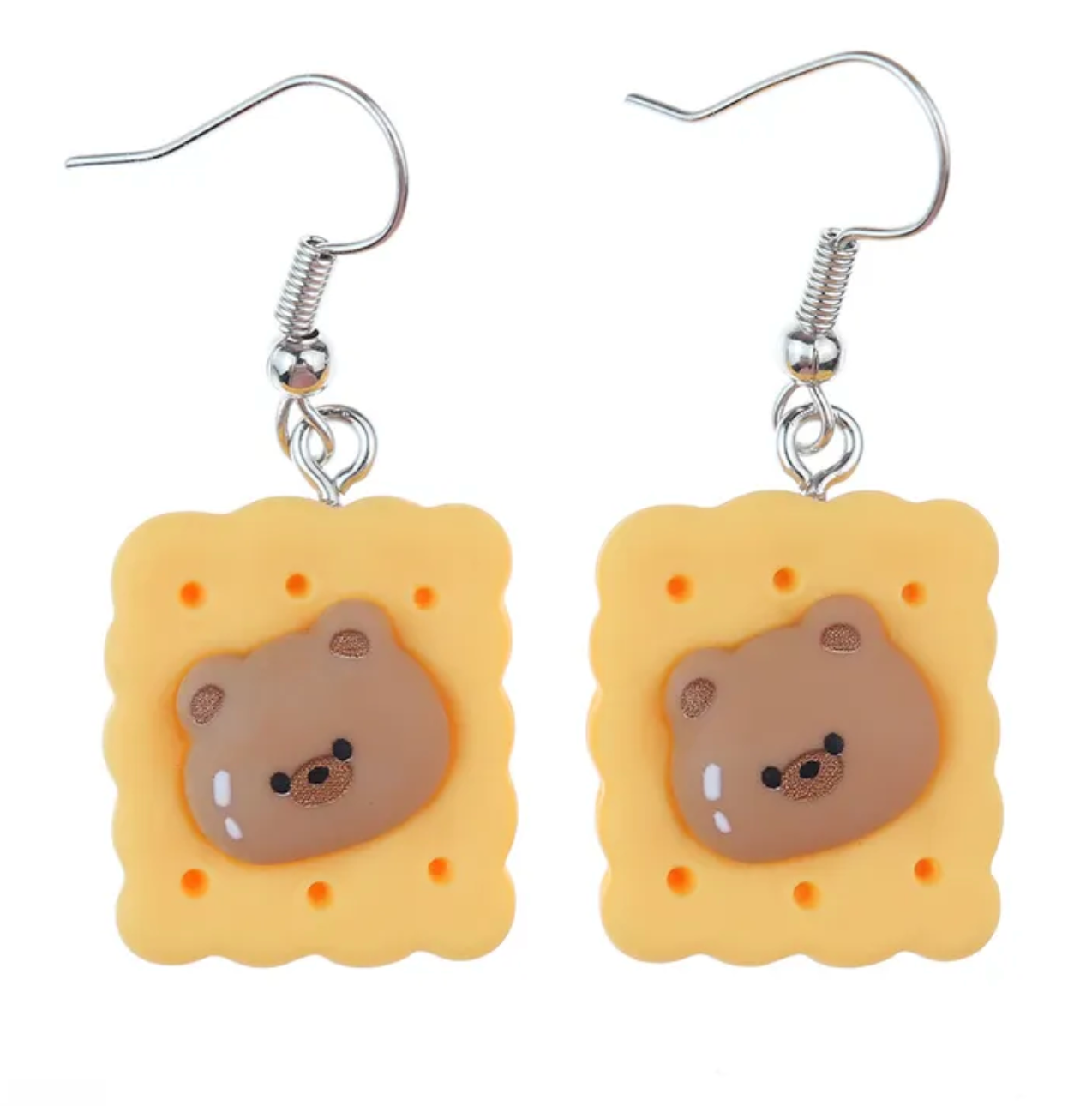 A proper tea biscuit at tea-time never hurt nobody. A round-faced teddy bear never did no harm. Now the two are joining forces to make for an adorable fashion statement.  Tea Time Biscuit Teddy Drop Earrings provide that adorable, funky pop style for the kawaii fashion lovers out there.