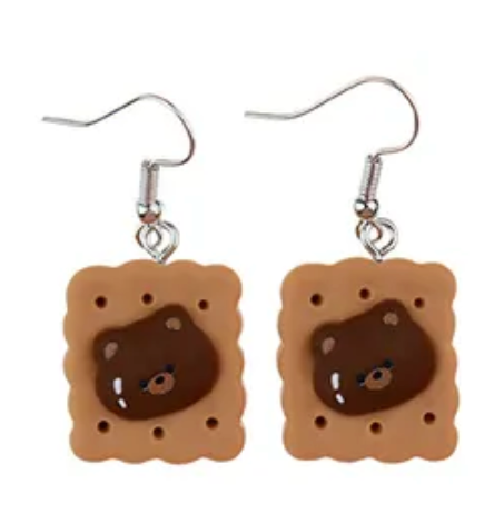 A proper tea biscuit at tea-time never hurt nobody. A round-faced teddy bear never did no harm. Now the two are joining forces to make for an adorable fashion statement.  Tea Time Biscuit Teddy Drop Earrings provide that adorable, funky pop style for the kawaii fashion lovers out there.