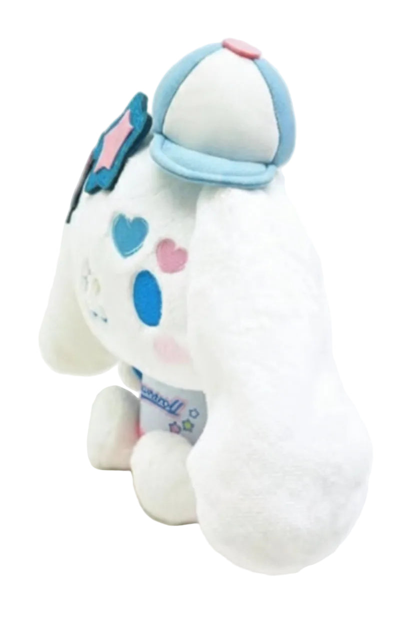 Say hello to the cutest little guy in the galaxy! This Y2K Heisei Cinnamoroll Plushie is dressed to impress in his adorable star-shaped shades, tiny cap, and Y2K attire. With his rosy cheeks and sweet smile, he’s ready to bring the maximum cuteness to your day. He may look innocent, but don’t let those sparkly glasses fool you—this little dude knows he’s the main character.