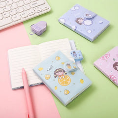 The Cutie Patootie Fruity Mini Notebooks come in four designs adorned with charming illustrations of smiley little girls alongside vibrant fruits, adding a burst of color and cuteness to your day. The velcro closure ensures your notes and ideas stay secure, making these notebooks perfect for on-the-go creativity.