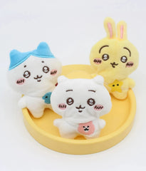 Bring the adorable world of Chiikawa and friends into your daily life with these delightful plush keychains! Inspired by the beloved characters from the Chiikawa manga series, each keychain features a mini, plush version of characters Chiikawa, Hachiware, and Usagi with embroidered details like big manga eyes, blushing cheeks, and coordinating crossbody bags.