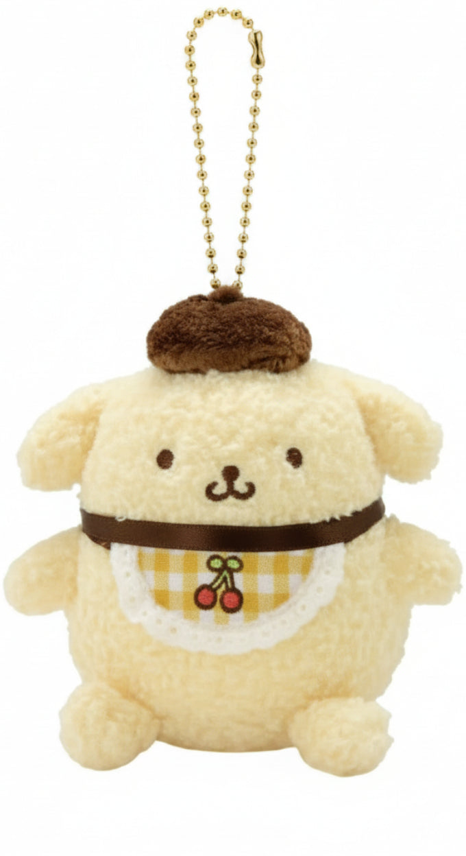 Meet the irresistible Yellow Cherry Check Baby Pompompurin Plush Keychain! It's giving retro-vibes as a charming and ultra-soft version of your favorite golden retriever character from Sanrio, simply dressed in the cutest bib with an adorable embroidered cherry on a yellow checkered pattern.