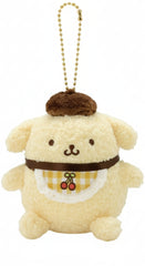 Meet the irresistible Yellow Cherry Check Baby Pompompurin Plush Keychain! It's giving retro-vibes as a charming and ultra-soft version of your favorite golden retriever character from Sanrio, simply dressed in the cutest bib with an adorable embroidered cherry on a yellow checkered pattern.